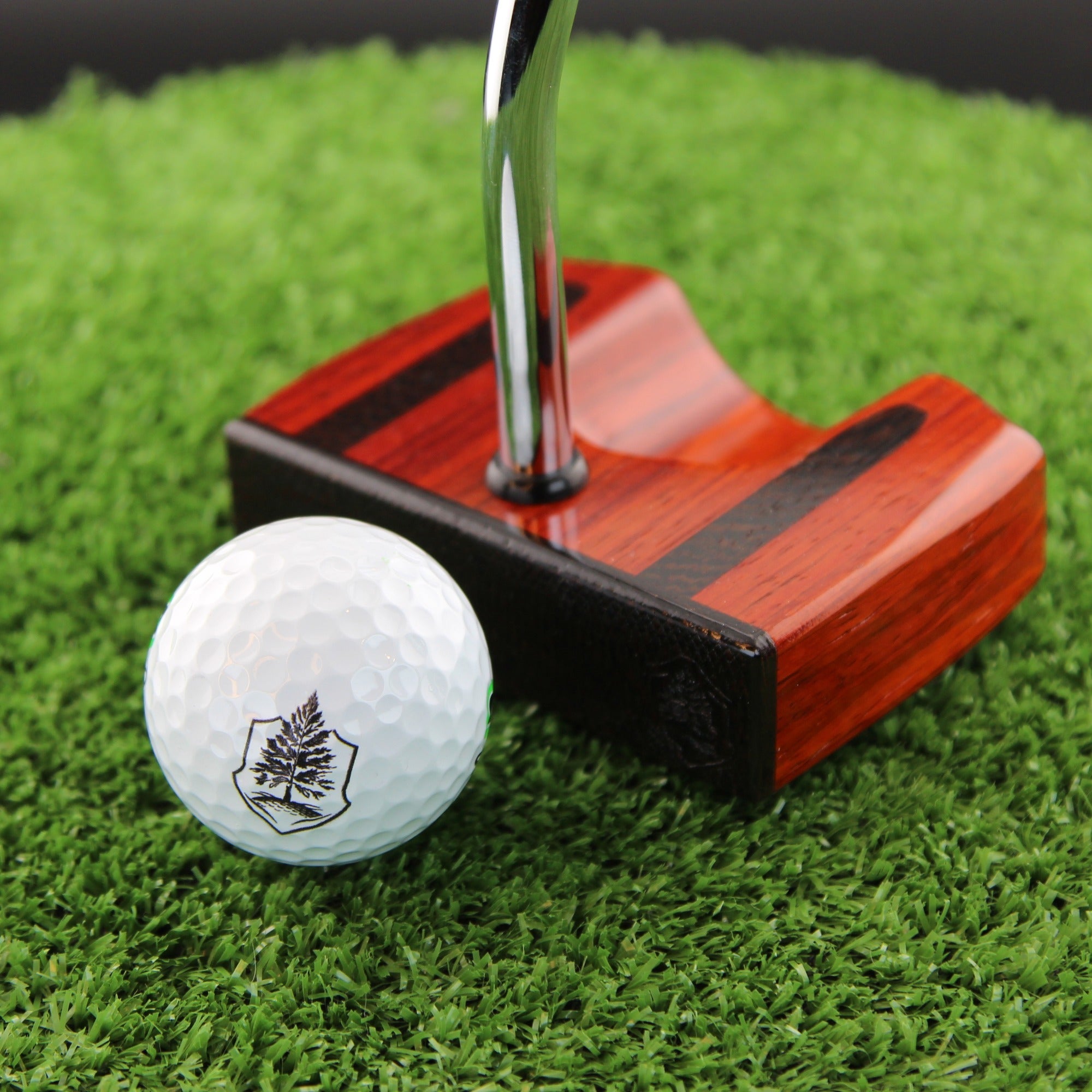 TimberTouch Bloodline blade wood putter with Padauk, Wenge and Bloodwood center shaft zero torque – face view with golf ball