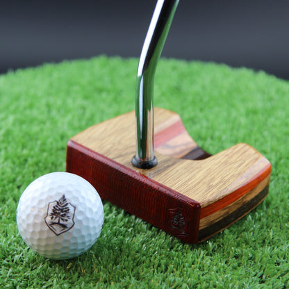 TimberTouch Korina Putter Woodrich Regal wood putter, White Limba and Padauk, zero torque center shaft – face view with golf ball