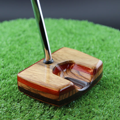 TimberTouch Korina Putter Woodrich Regal wood putter, White Limba and Padauk, zero torque center shaft – sole and toe angle view