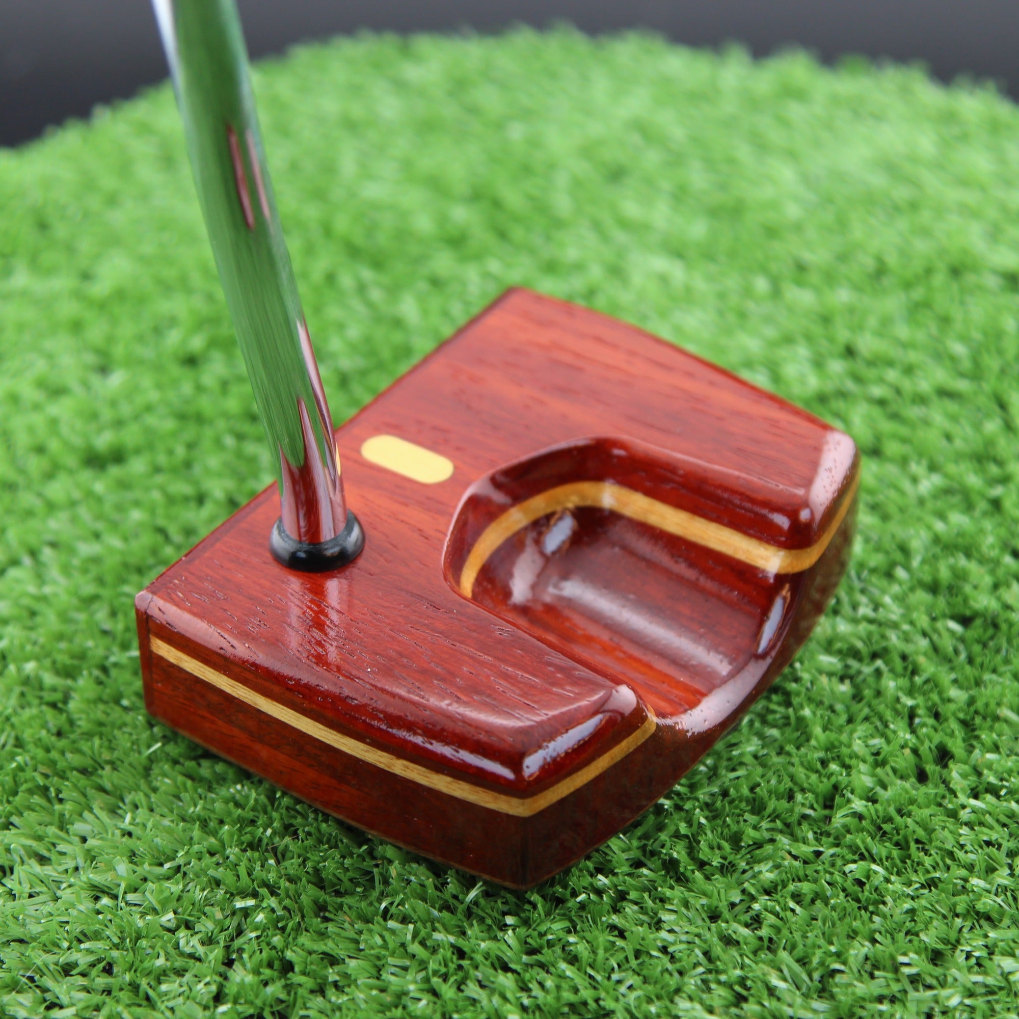 TimberTouch Woodrich putter in Padauk, Walnut and Canarywood - sole and toe angle view
