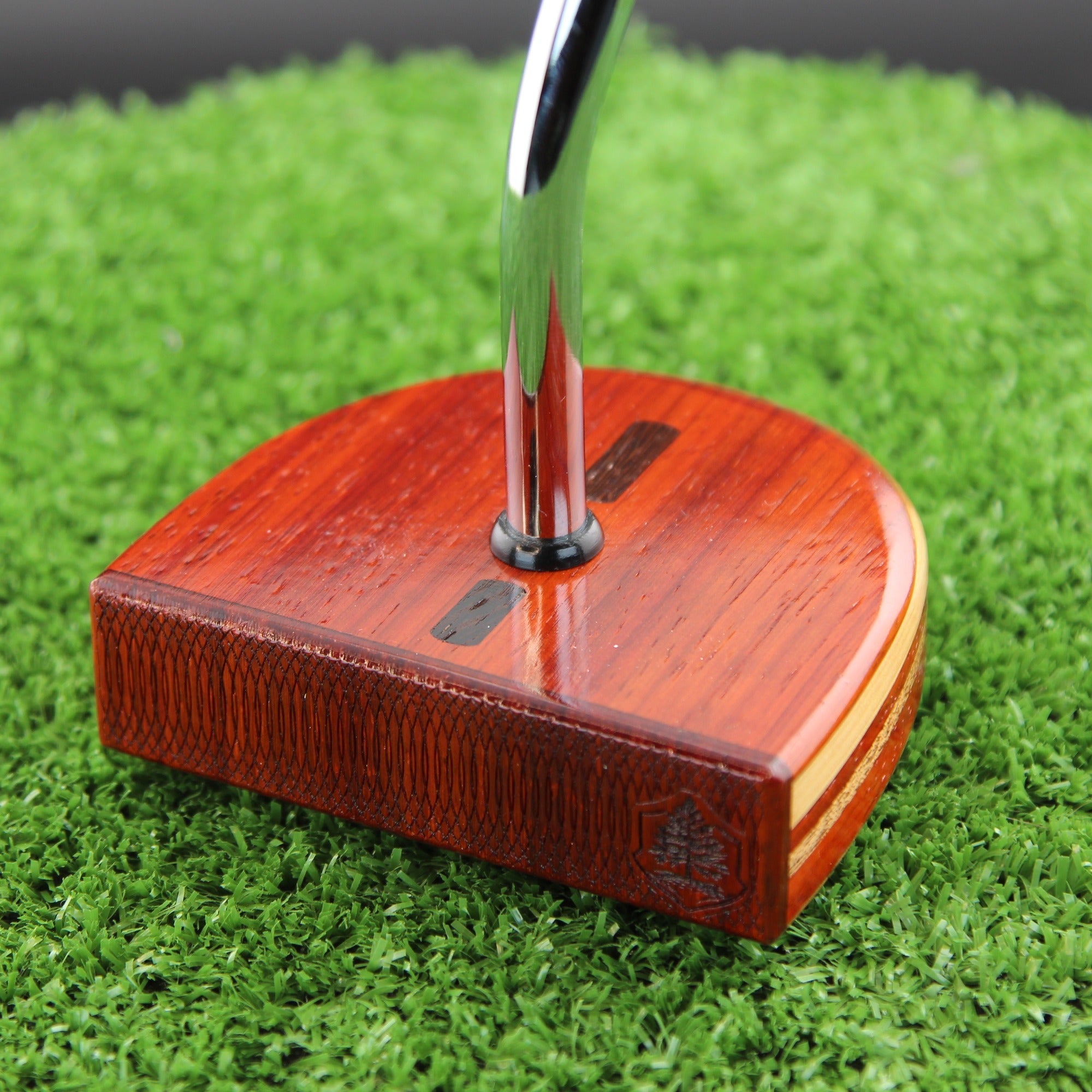 TimberTouch mallet wood putter with Padauk, Zebrawood and Cedar center shaft zero torque – face and heel angle view