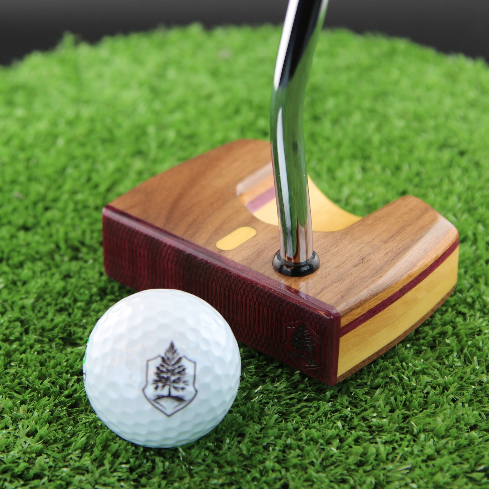 TimberTouch Woodrich wood putter with Yellowheart, Walnut and Canarywood alignment inlay – face view with golf ball