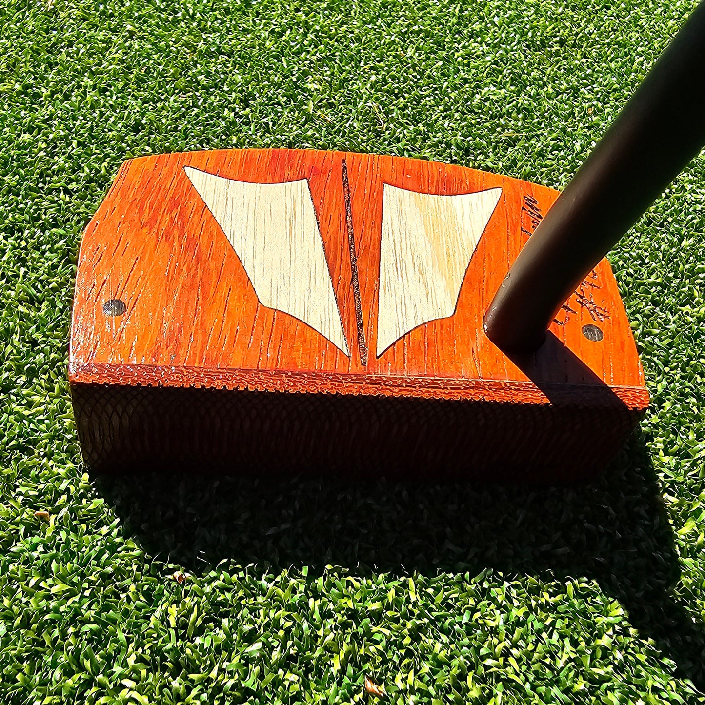 Padauk wood body putter with Maple inlays