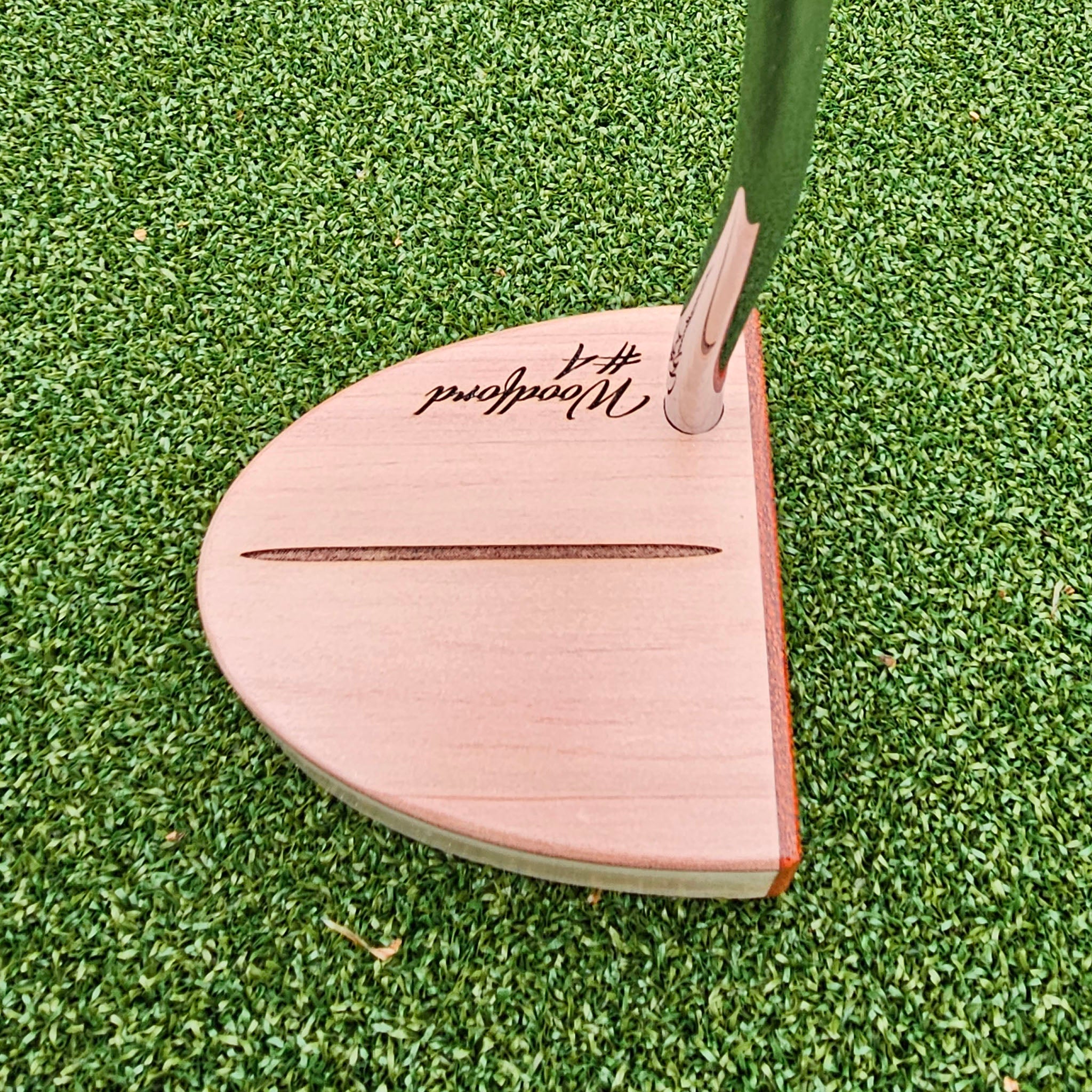 Curly Maple Body, Red Cedar top plate putter with Padauk Face plate